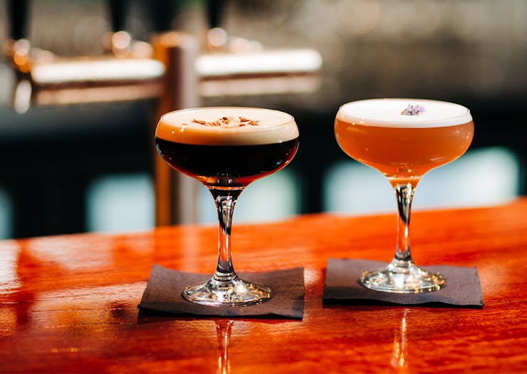 an espresso martini sitting on the bar