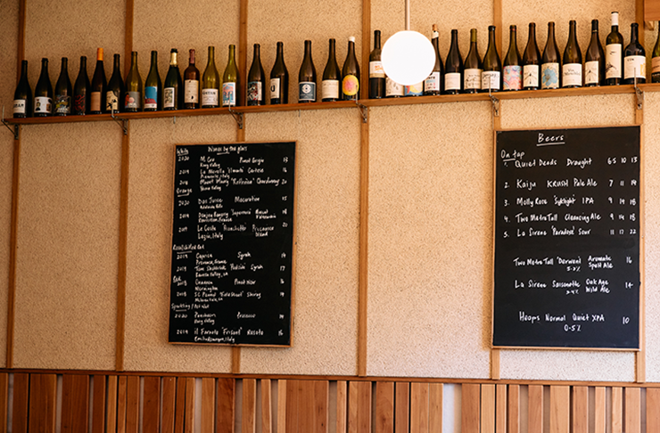 The specials board at a wood-furnished wine bar.