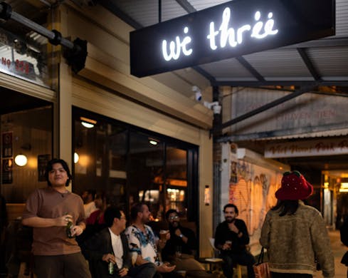 people standing outside we three bar marrickville