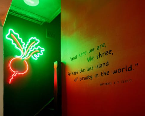 neon radish light and quote on wall at we three bar marrickville