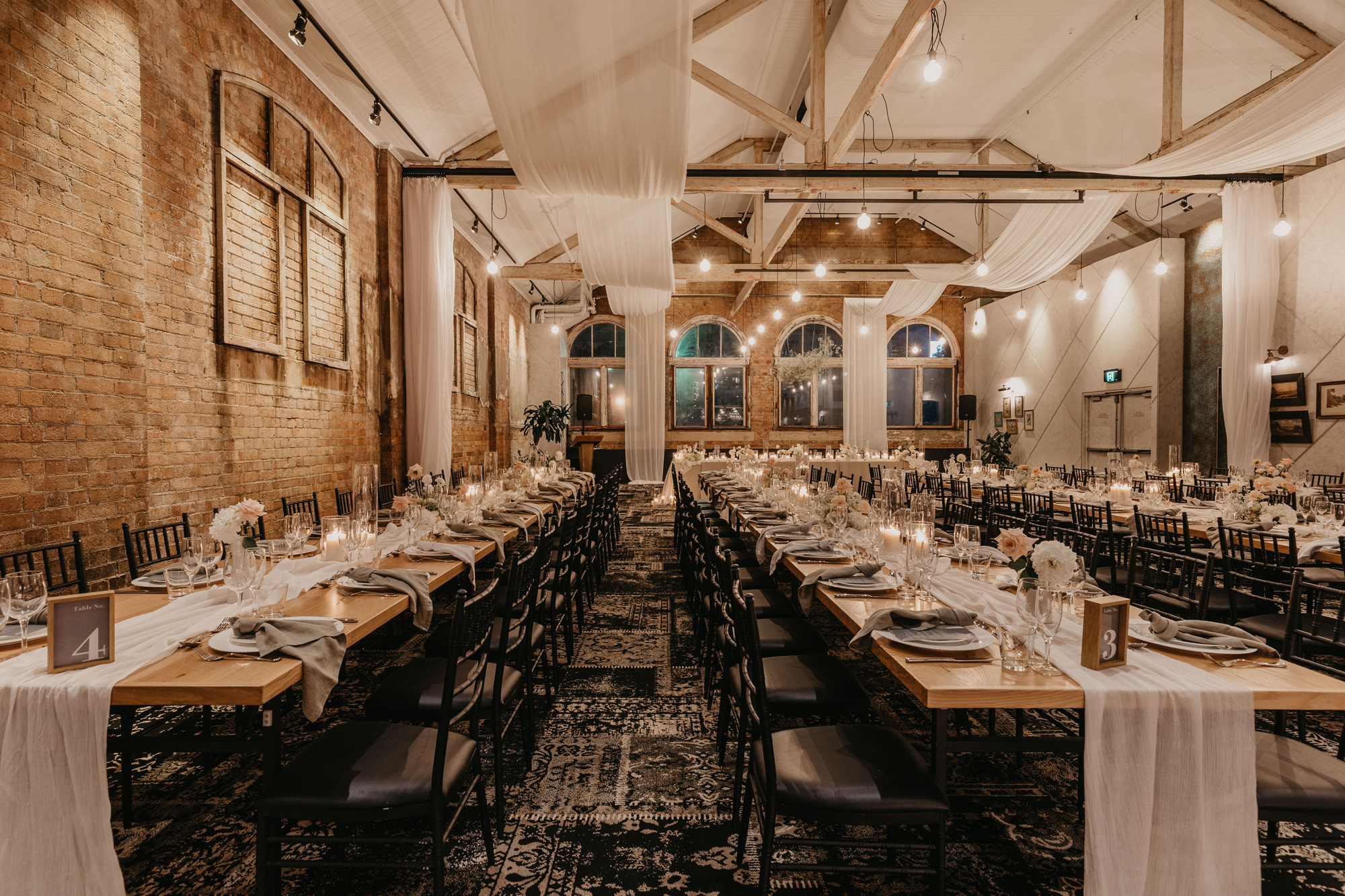 a heritage room filled with banquet tables at the warehouse, a brisbane wedding venue