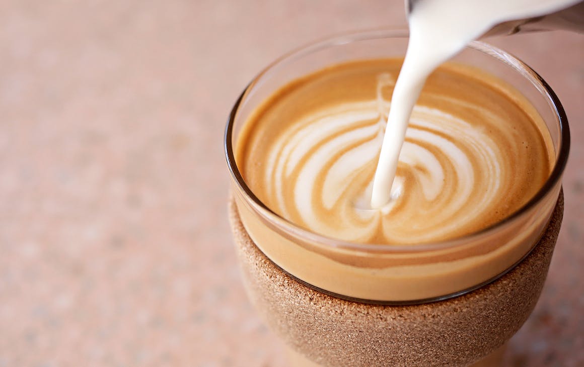 a coffee being poured at a cafe open on January 26 public holiday in Perth