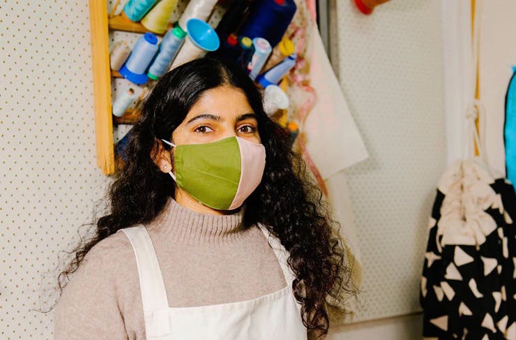 A woman wearing one of the Second Stitch face masks. 