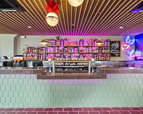 an aqua tiled bar