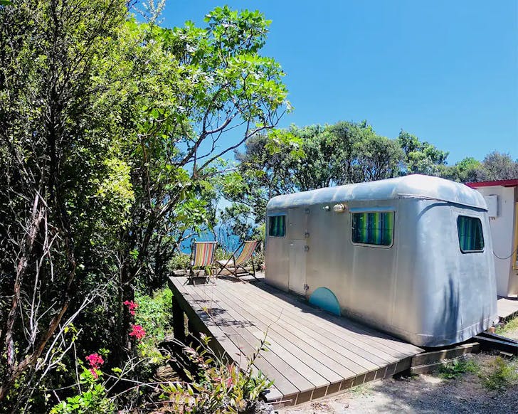 1940s Caravan Willis perched overlooking Tryphena harbour.