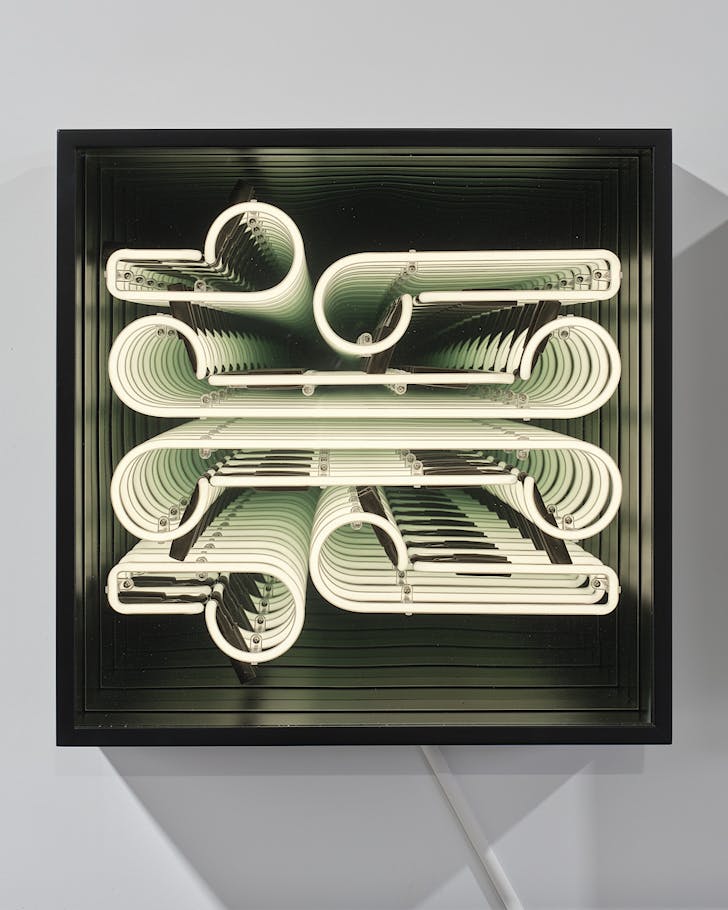 A pale green, neon-lighted installation for NgÄ Hau e WhÄ | TÄmaki Makaurau.