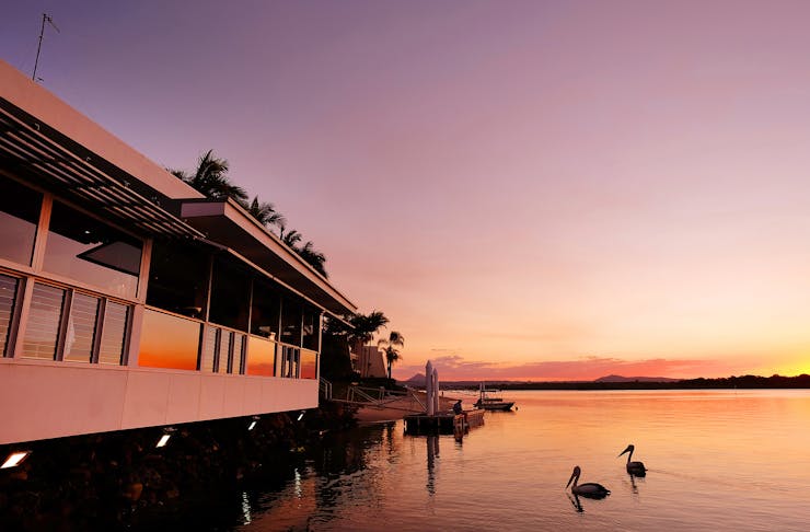 A beautiful sunset shot of the Winston restaurant on the Noosa River