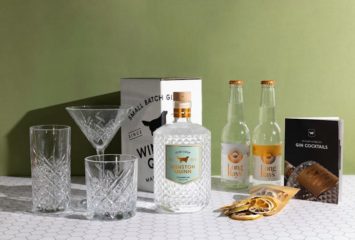 a bottle of gin and glasses