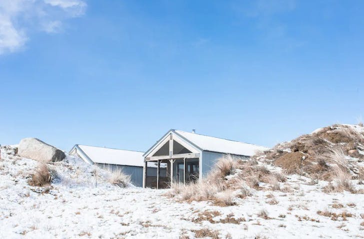 A cabin in the snow, one of the best winter getaways in NSW