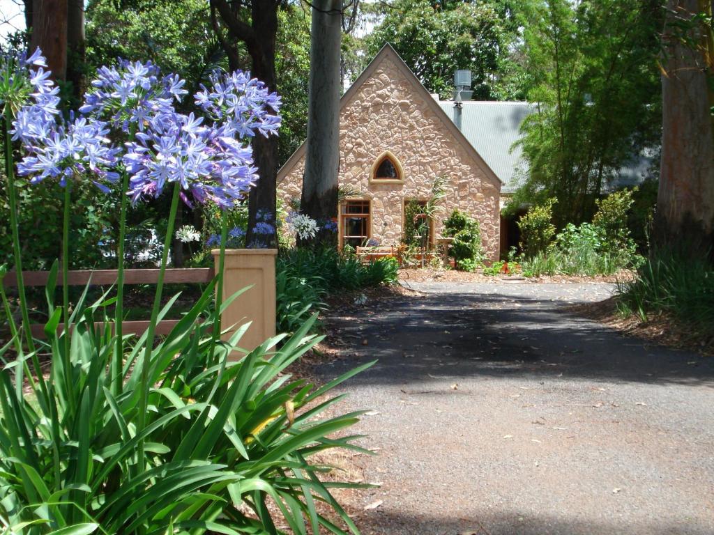 a stone cottage in a garden