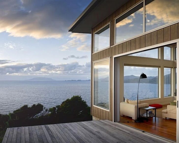 A bach looks out over the water.