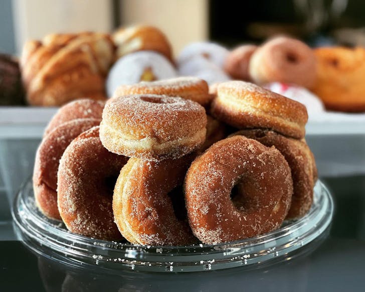Delicious doughnuts on a plate at Ya Bon French Baker, one of the best cafes in Hastings.