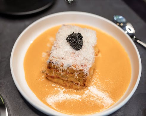 a plate of saucy crab lasagne