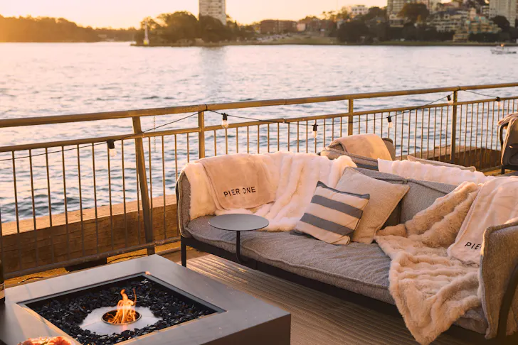 small firepit with chairs by the harbour