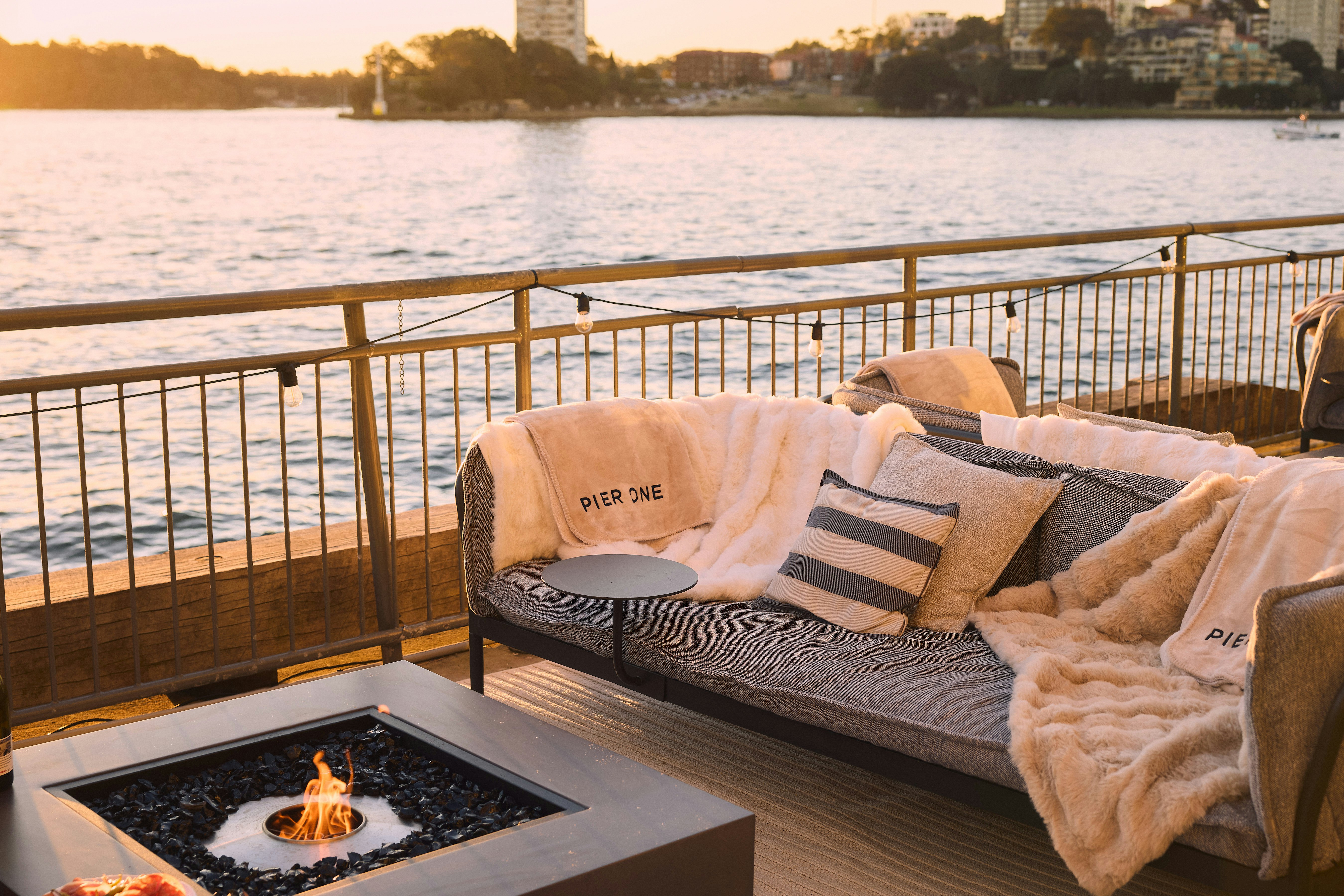 small firepit with chairs by the harbour