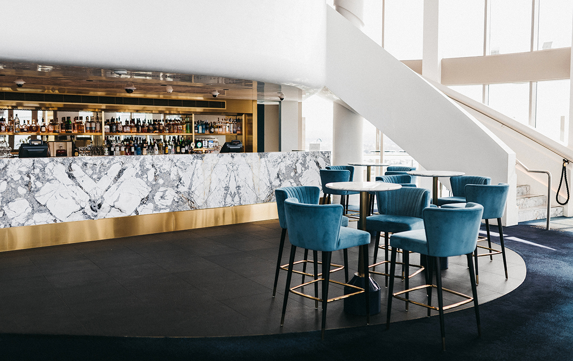 a blue leathered rooftop bar interior