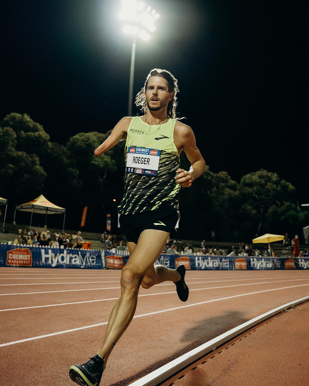 Michael Roeger running on a track