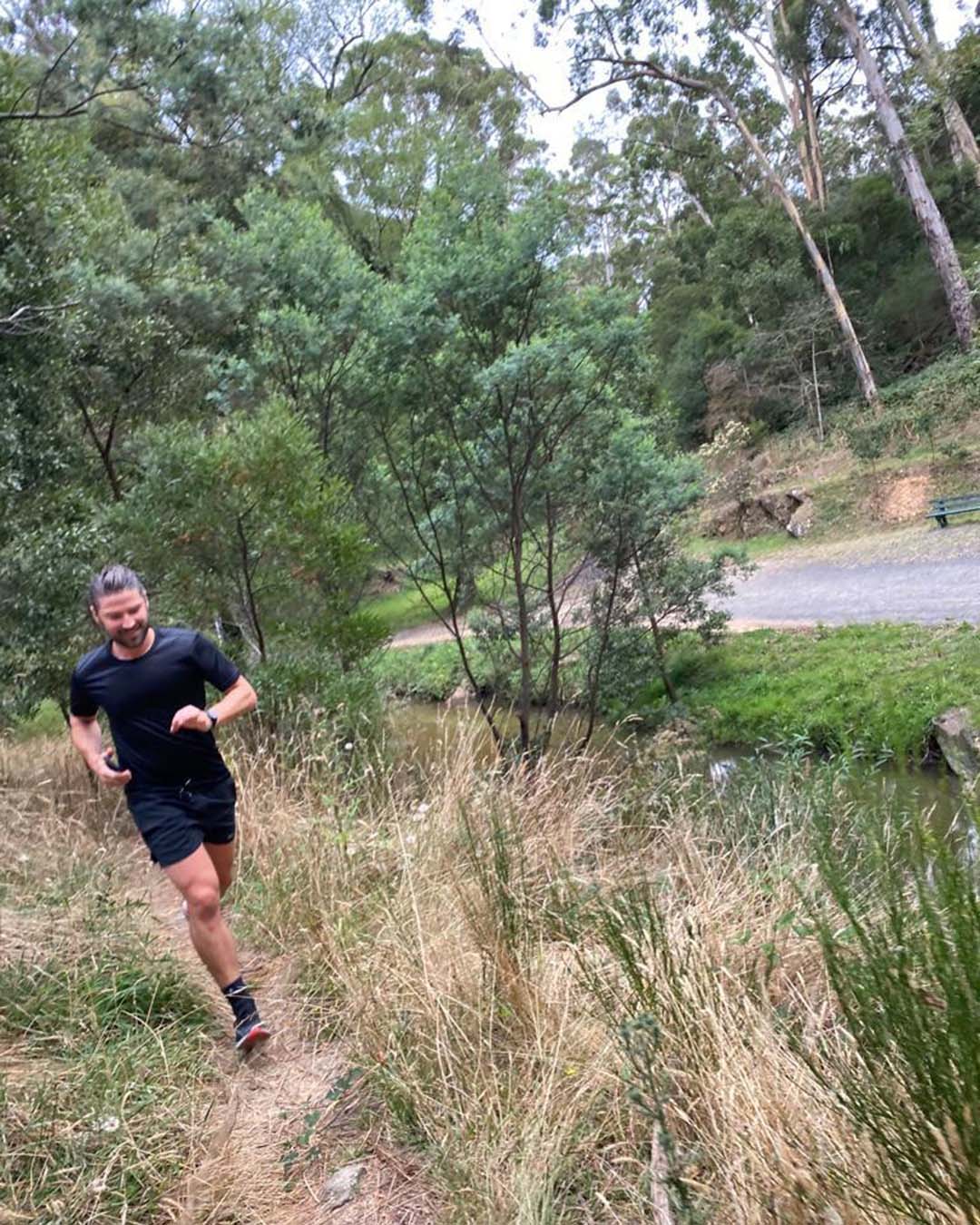 Hamish running in bush land 