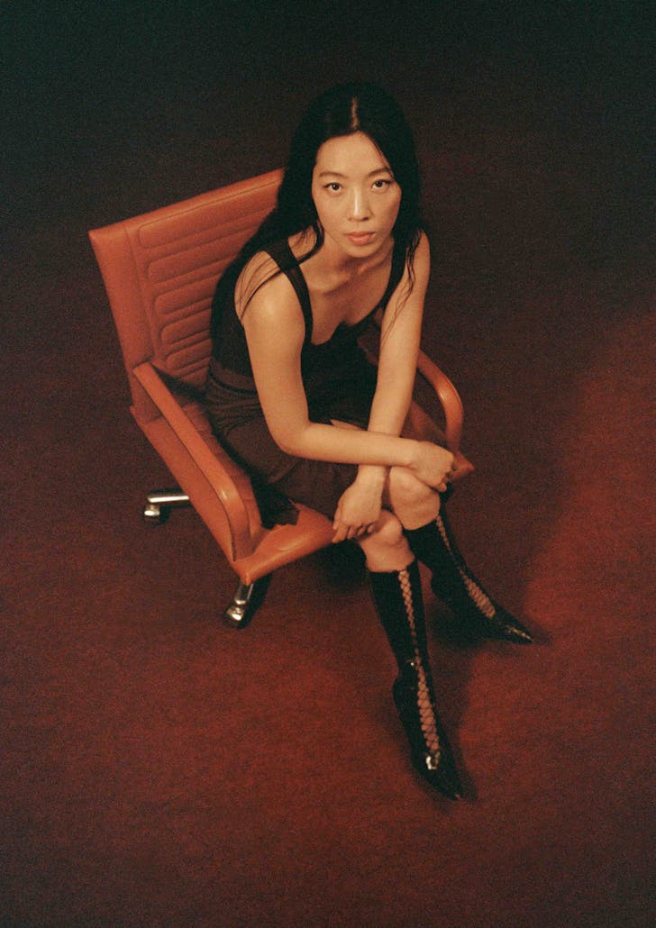 a person sitting on a seat looking up