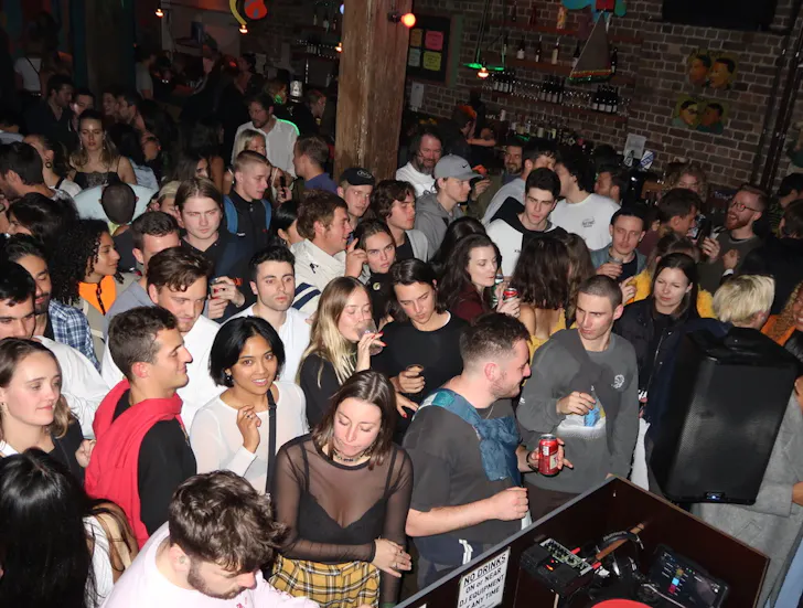 a crowd of people on a dancefloor