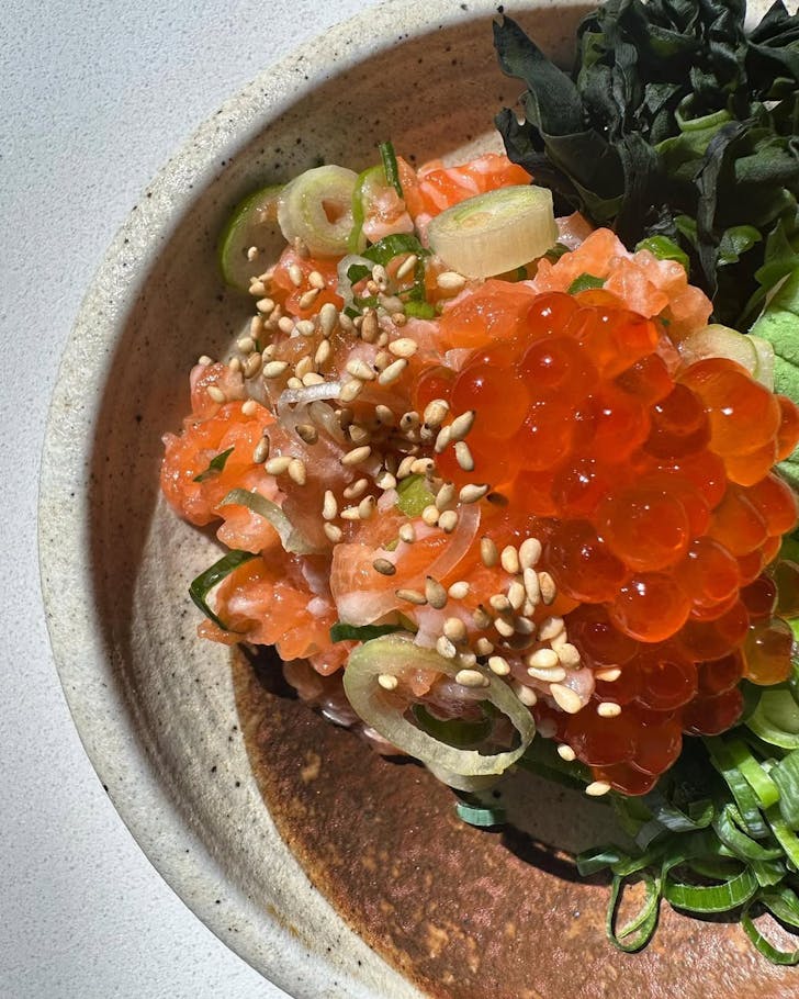 a raw salmon bowl topped with roe at inner west sydney cafe kurumac