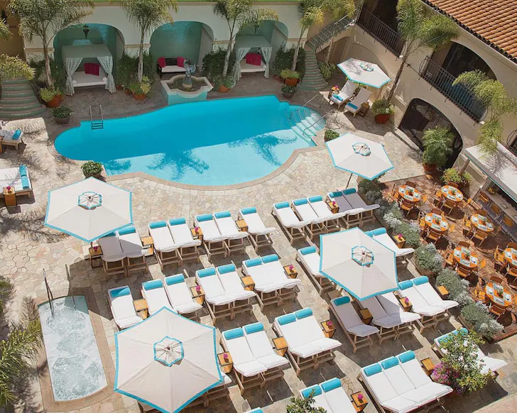 A view of the pool at Beverly Wilshire, A Four Seasons Hotel one of the best hotels for families Los Angeles