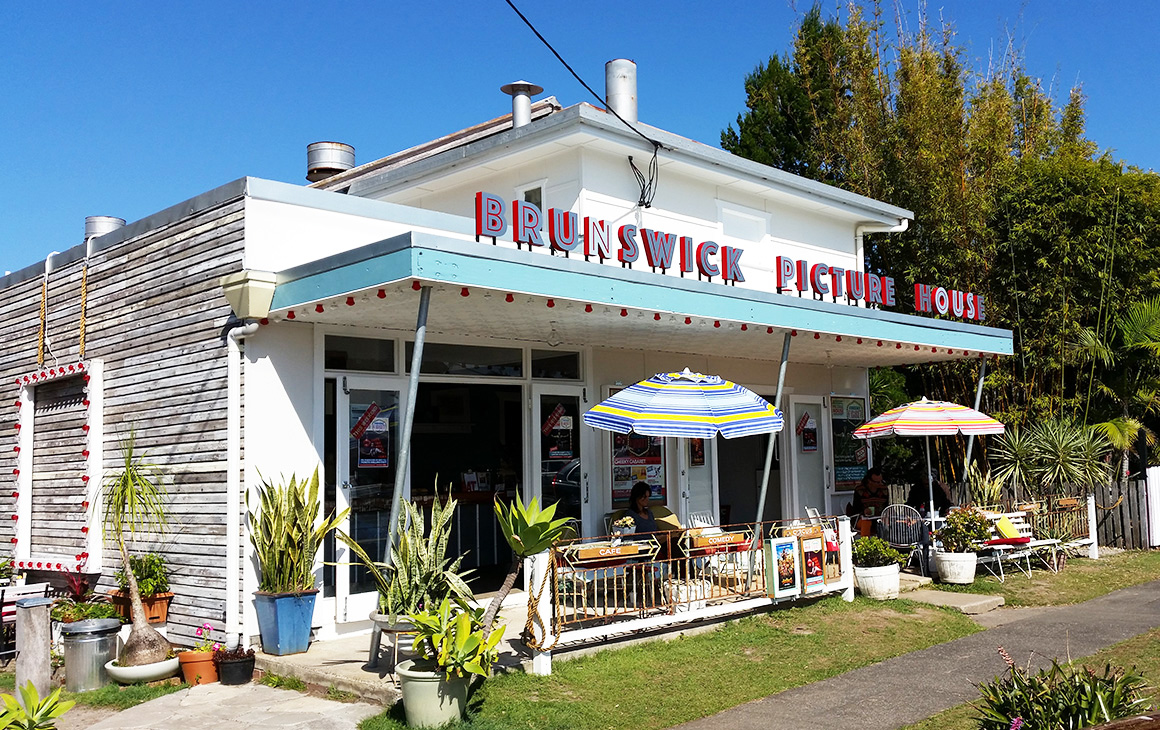 the outside of retro Brunswick Picture House. Brilliant blue sky behind it.