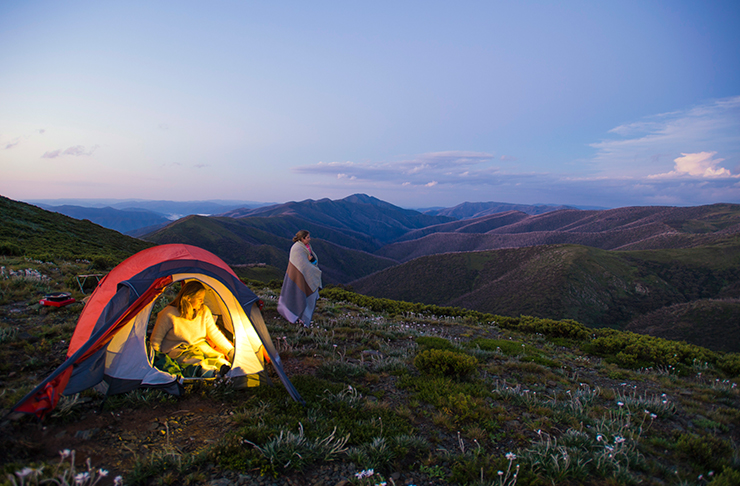 two people camping on top of mountain