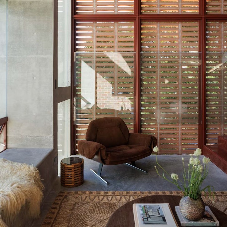 chair in the corner of a design forward airbnb in sydney