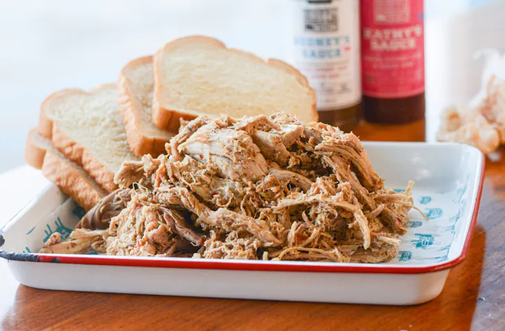 A plate of pulled pork and white bread from Rodney Scott BBQ
