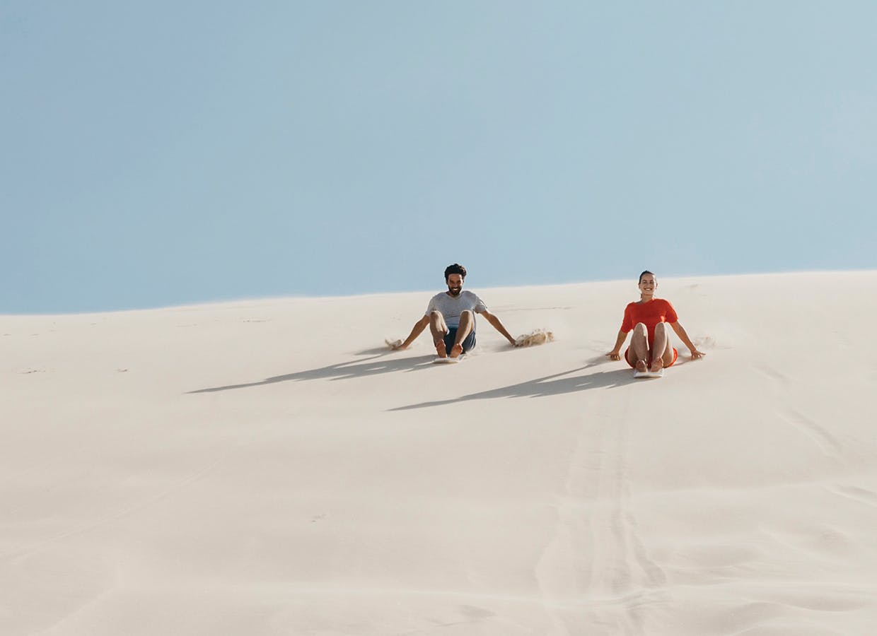 Two people sanduning. 