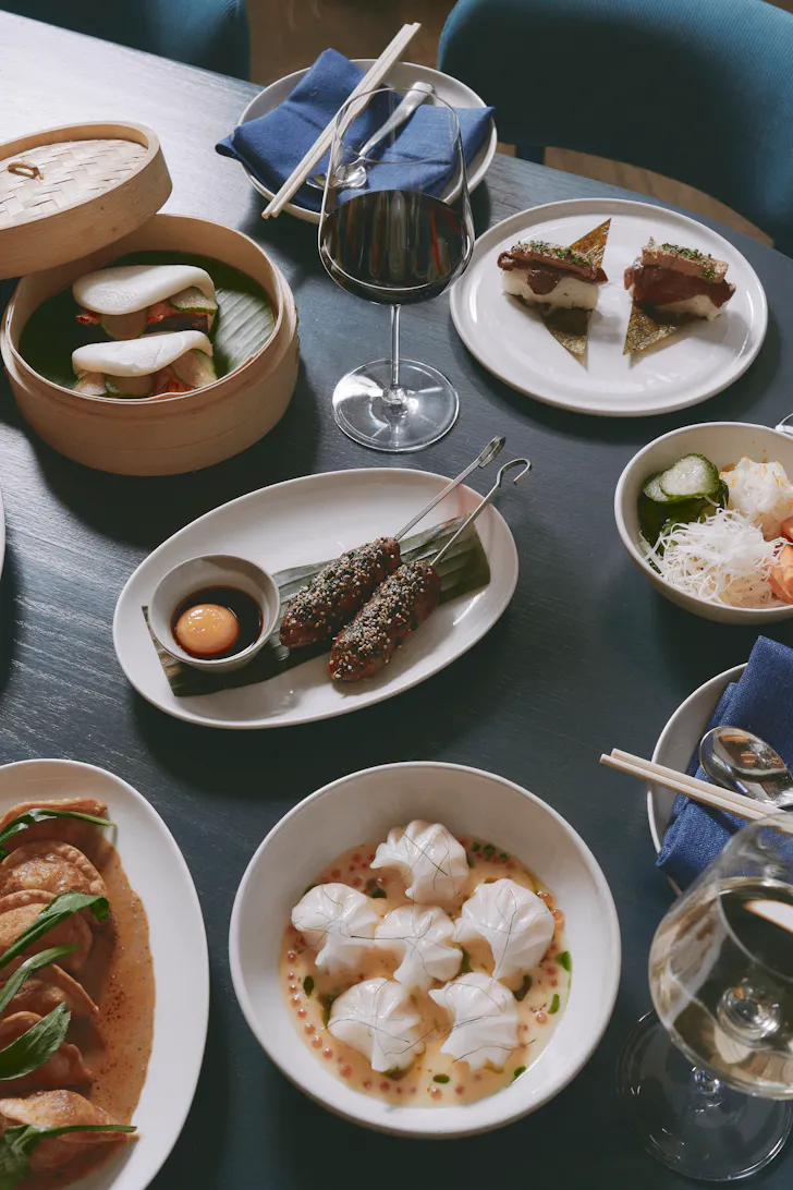 a spread of dim sums on a table