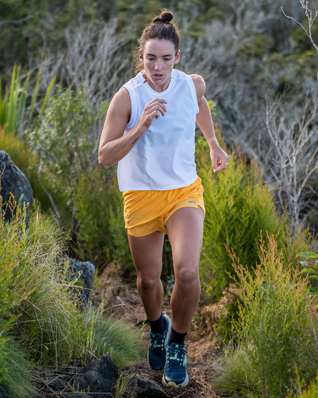 Jacqui Bell running in the bush wearing Brooks shoes