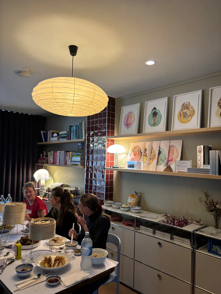 a design forward nook in a shop with books and lights