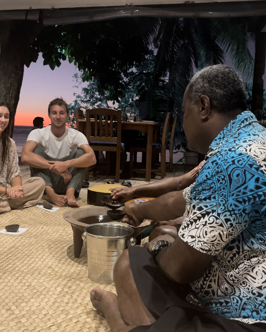 Kava ceremony at Blue Lagoon Resort with the sunset in the background