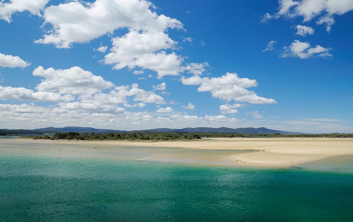 Sparkling blue-green water meets the sandy beach of Mallacoota