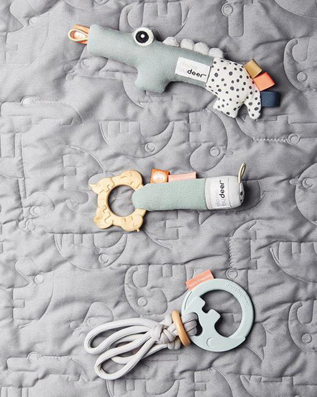 baby shower gift idea: soft rattles on a rug