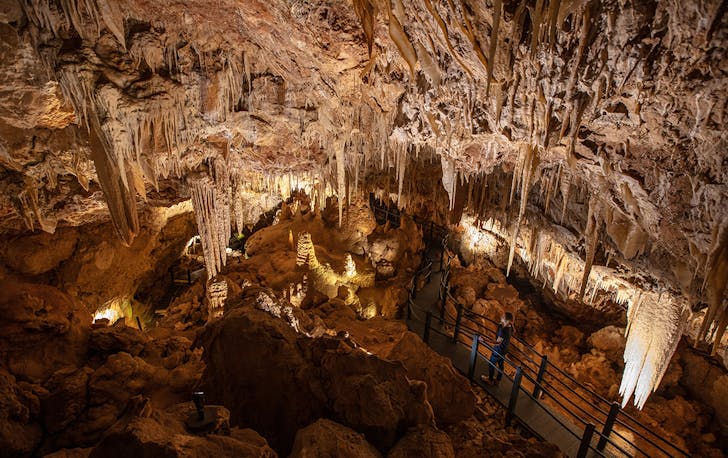 A warm glow peaks out of NGILGI Cave