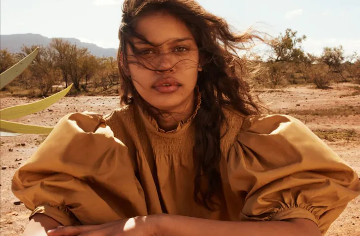 Woman in the desert wearing R.M.Williams. 
