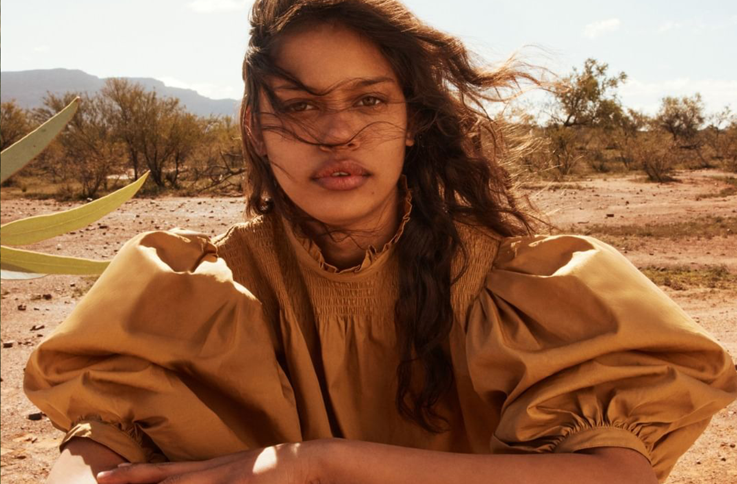 Woman in the desert wearing R.M.Williams. 