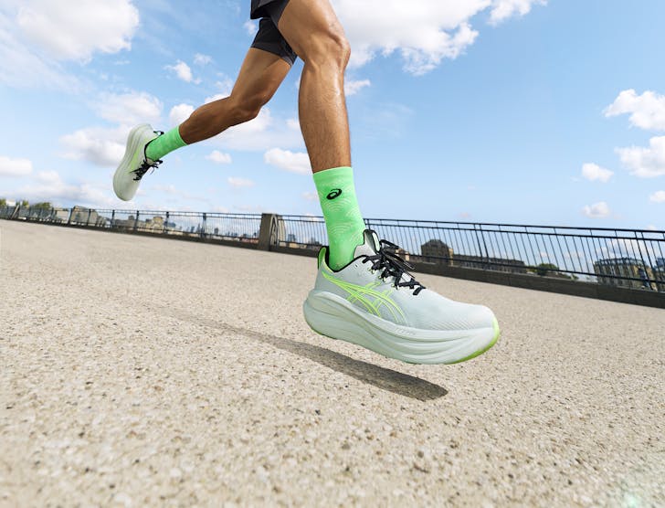 a person running with asics sneakers on