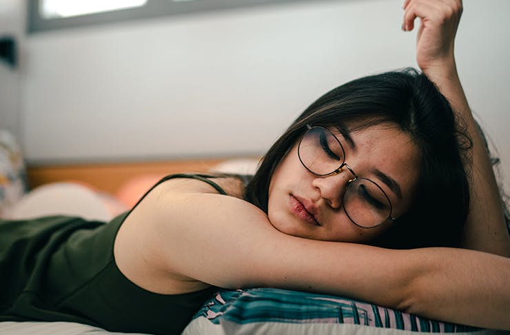 Girl sleeping with glasses on. 