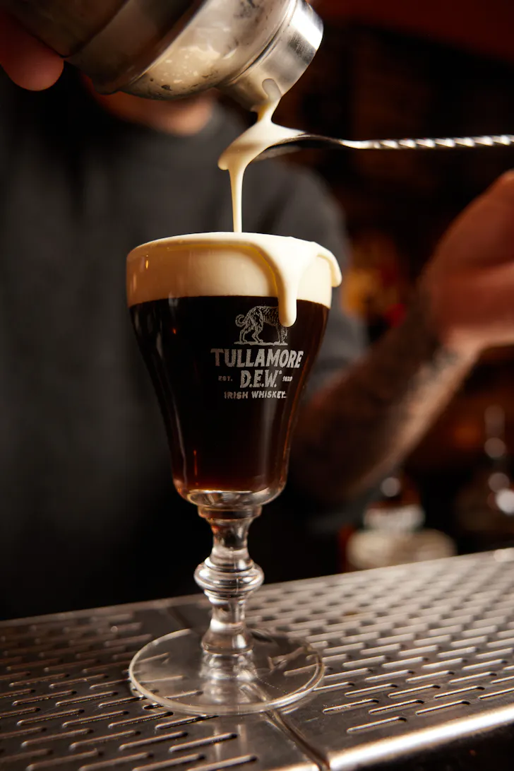 an overflowing pint of guiness