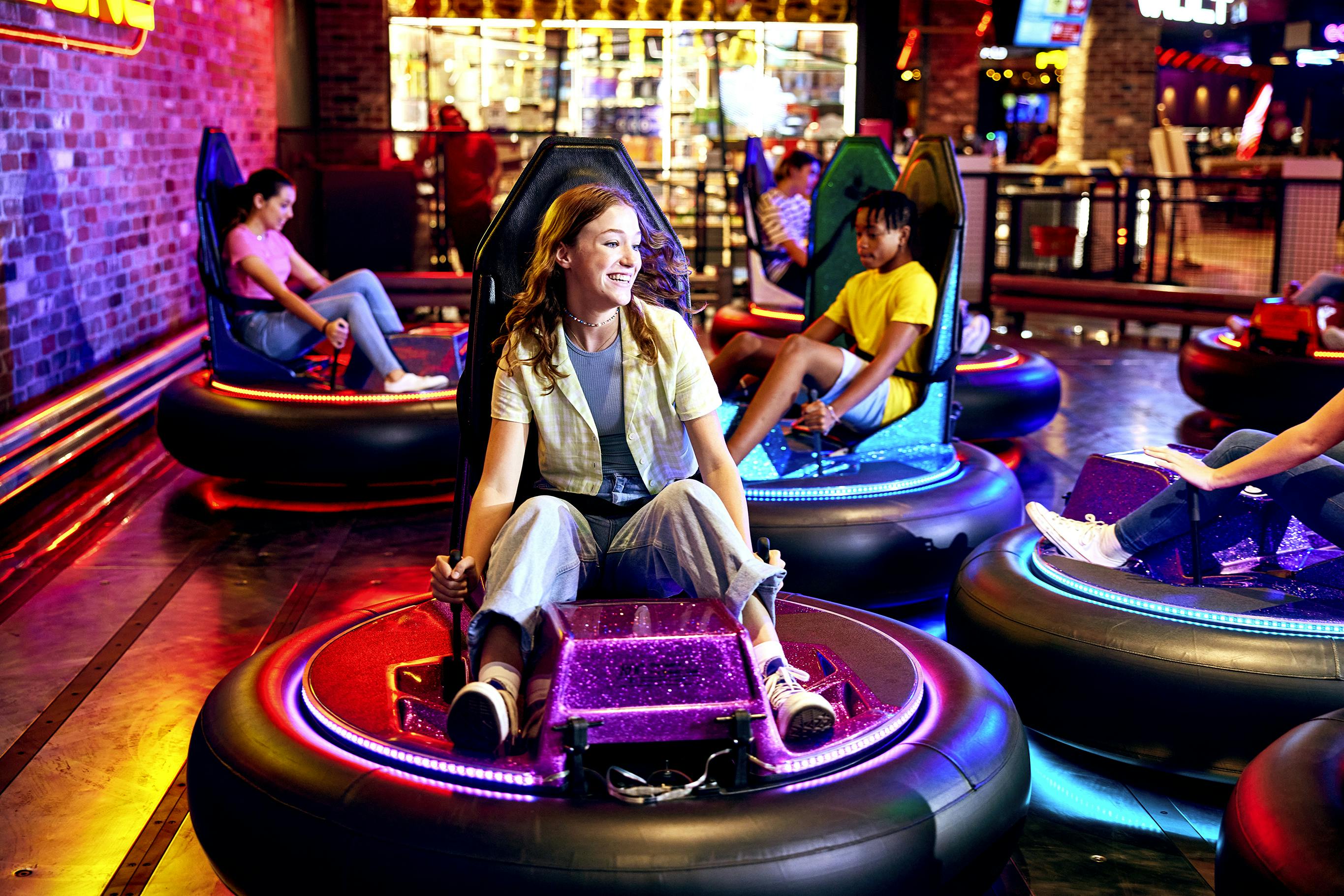 Woman playing bumper cars at Timezone. 