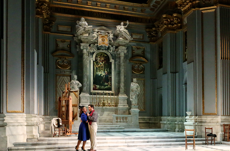 two people dancing together on stage