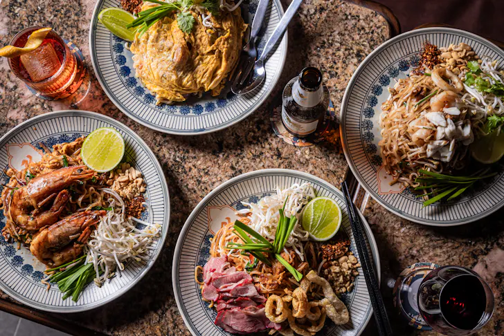 a spread of thai food on a table