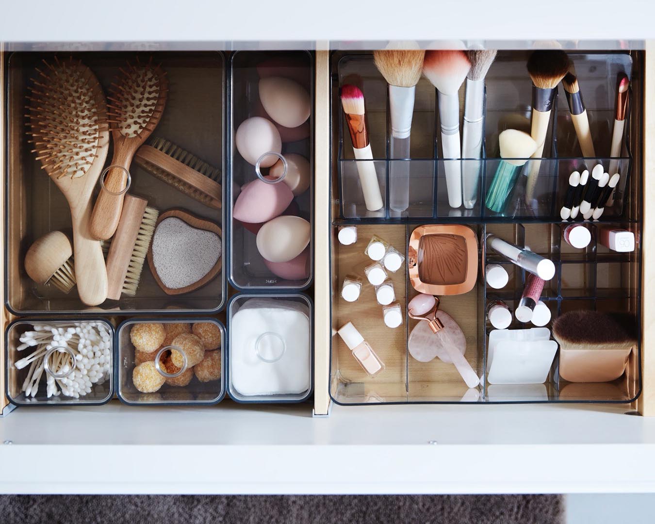 IKEA drawer storage and make-up brushes in bathroom.