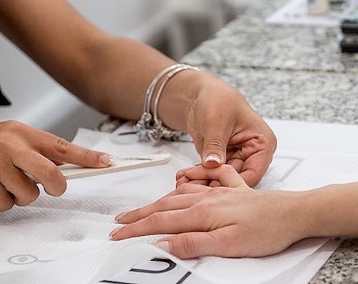 A manicure service at Unique Beauty and Style.