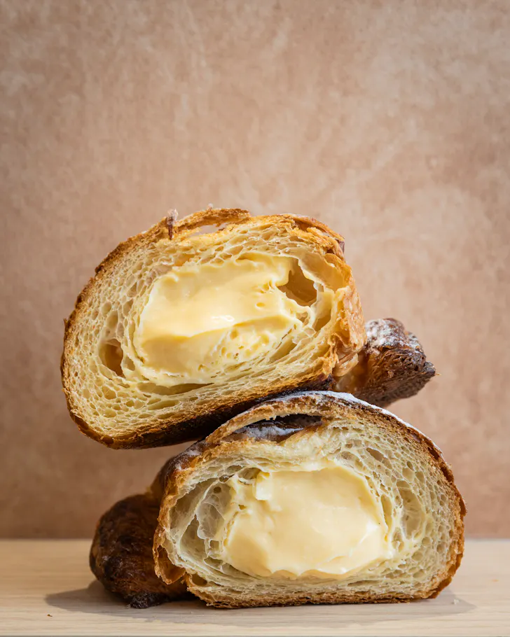 a cornetto pastry cut in half