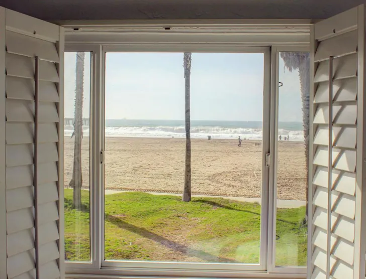 A view of the beach from a window at Venice On The Beach Hotel one of the best beach hotels Los Angeles